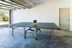 Rollaway Ping Pong Table located in the garage for hours of family fun.